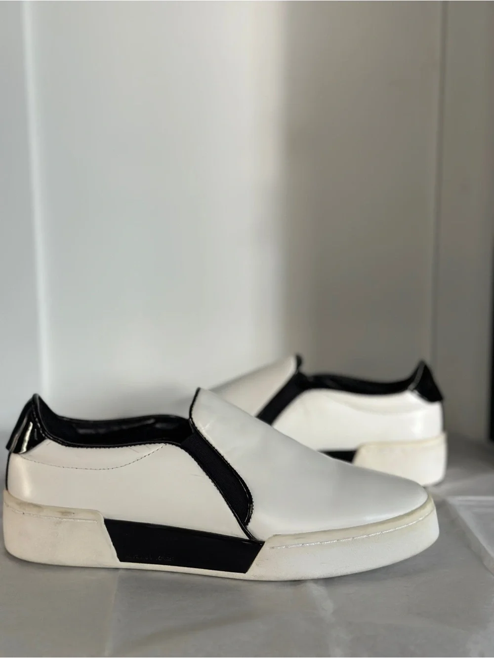 Michael Kors White and Black Slip-On Sneakers